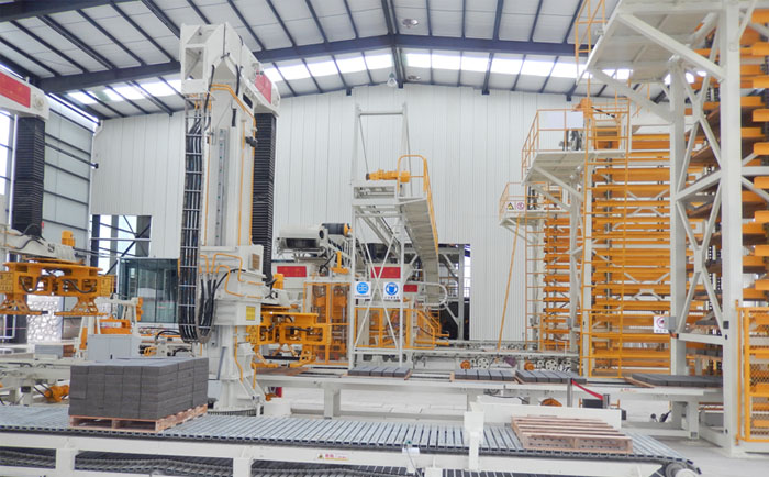 全自動雙機并列透水磚機生產線建廠解決方案